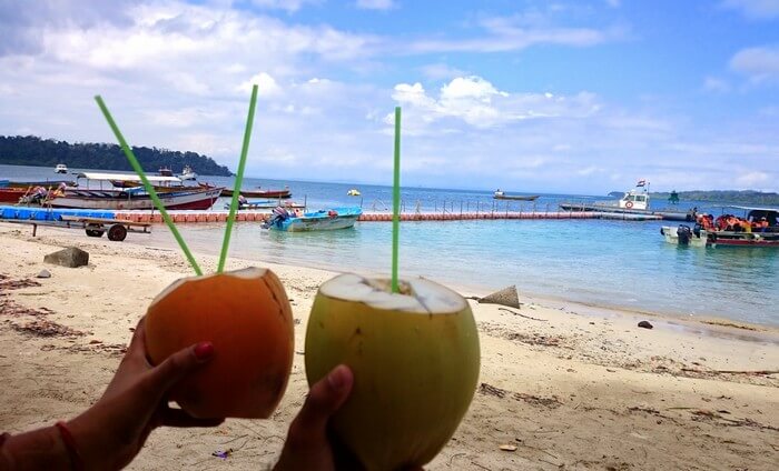 Abhinav and his wife having nariyal paani in Andaman