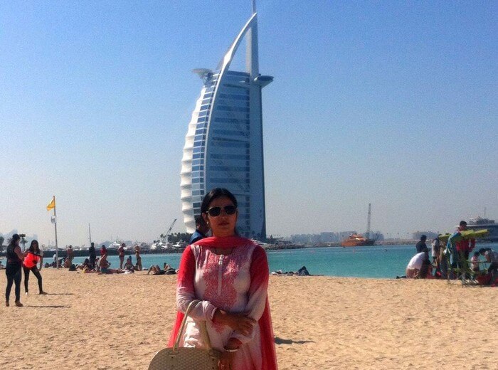 Kapil's wife at the Jumeirah Beach with the Burj-al-arab in the background
