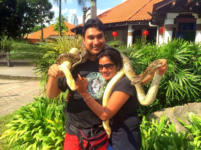 Ram and Kavya with a giant snake in Sentosa Island