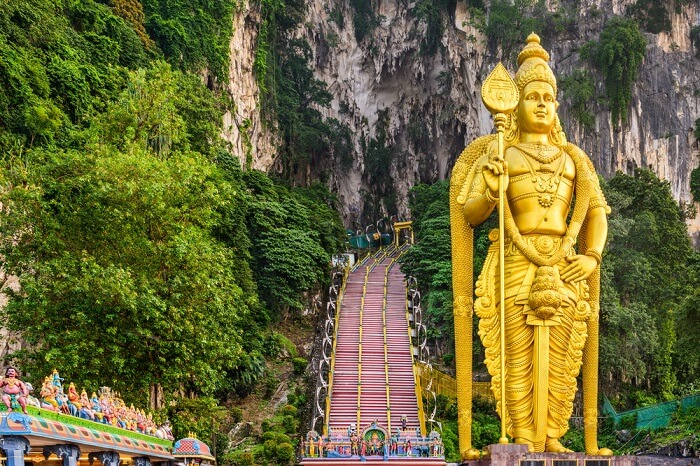 People come from all over the place to visit this beautiful golden idol of Lord Murugan at Batu Caves in Kuala Lumpur