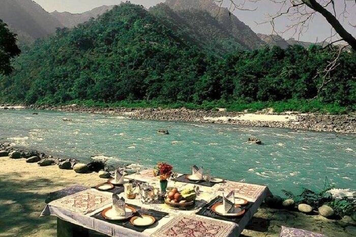 Riverside dining at the Glasshouse-on-Ganges from Neemrana