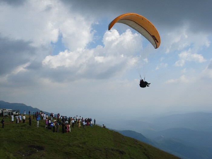 A person paragliding at the beautiful Kamshet hill