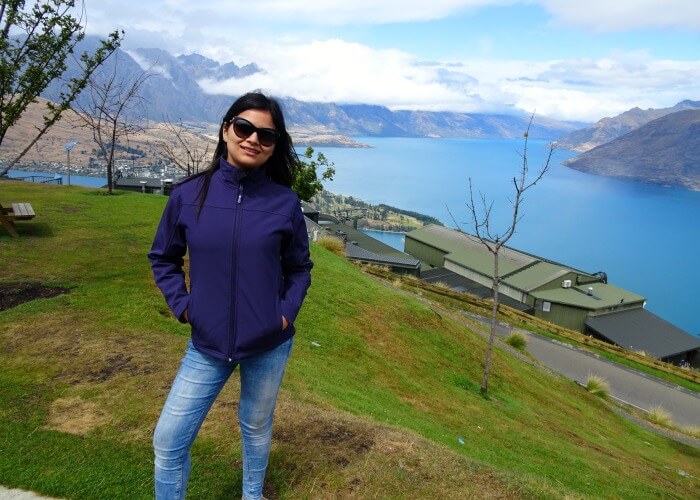 Anikta in the background of scenery in Queenstown