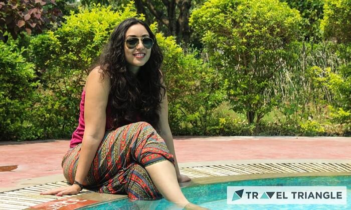 A girl by the swimming pool in Jim Corbett