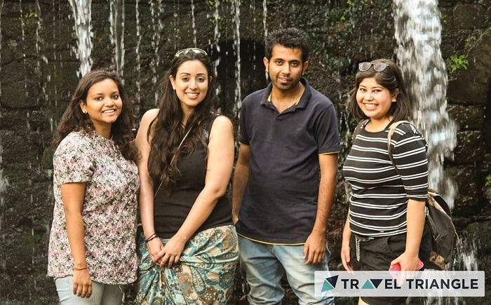 Friends near a waterfall in Jim Corbett