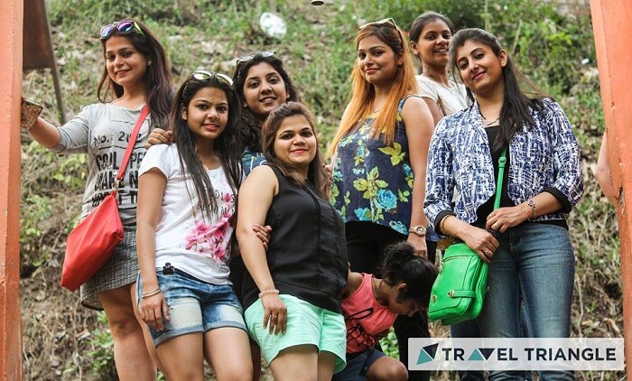 Girls pose for a photo in Jim Corbett