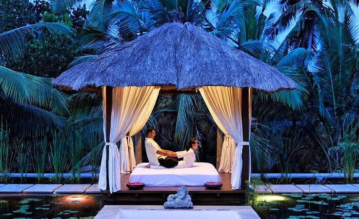 An outdoor spa-massage station at Niraamaya Retreats in Kovalam