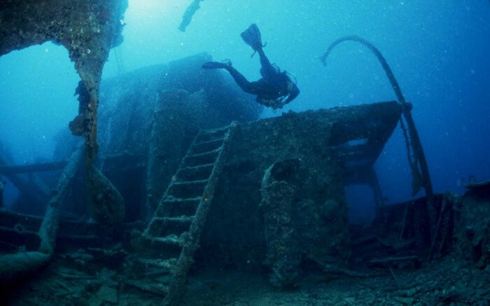 A diver explores the Yongala shipwreck in Australia
