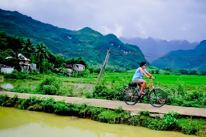 A tourist takes a cycling tour of Mai Chau