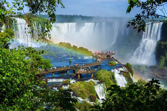 Tourists gather at the top of the Iguazu Falls at the border of Argentina and Brazil