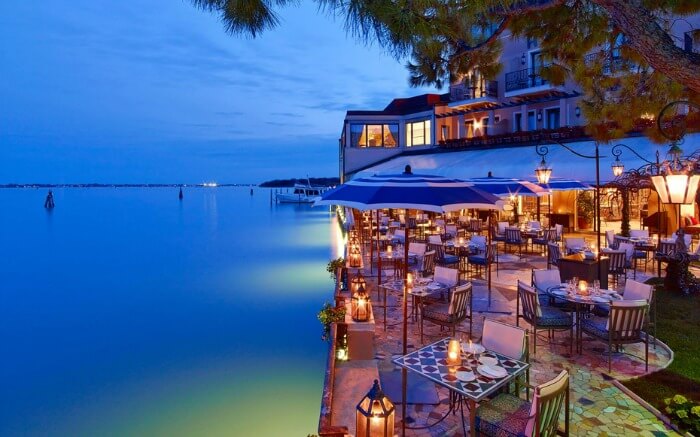 The outdoor restaurant seating area at Belmond Hotel Cipriani