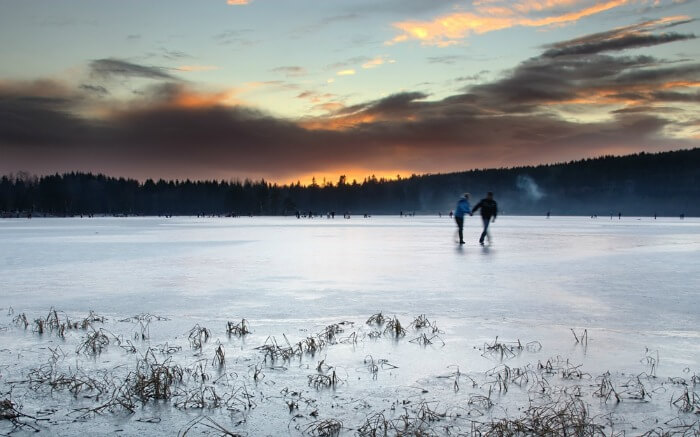 Couple on a frozen lake