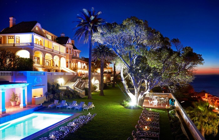 The pretty gardens and poolside deck of the Ellerman House