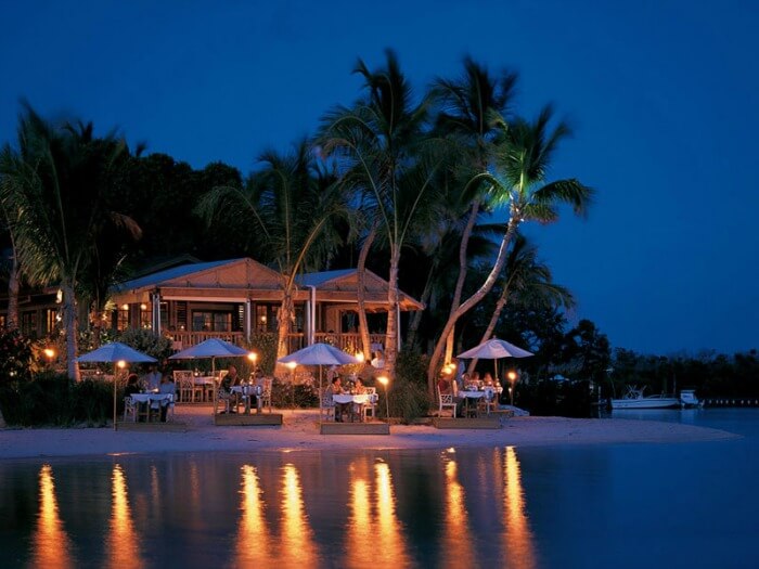 Shacks by the sea at Little Palm Island Resort & Spa
