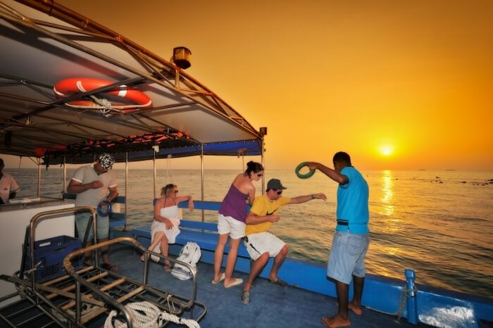 People enjoying night fishing at Bandos Beach in Maldives