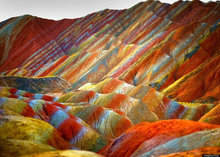 Watch diferent shades of colors at this rainbow mountain