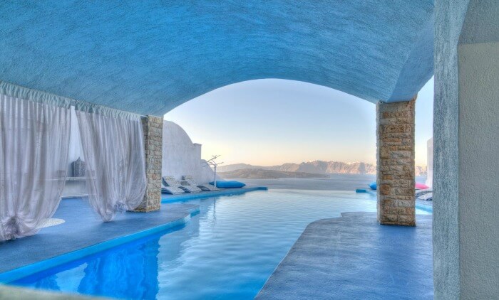 A natural outdoor pool at Astarte Suites