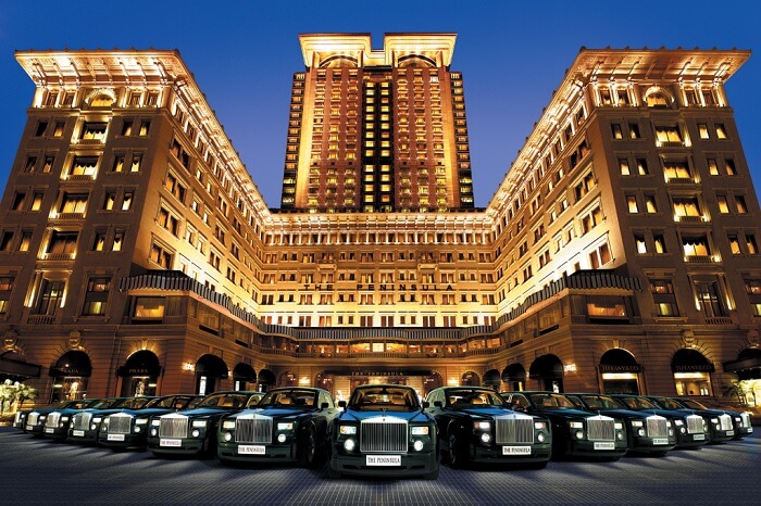 A fleet of Rolls Royce Phantom lined up in front of the Peninsula hotel that is one of the best luxury hotels in Hong Kong