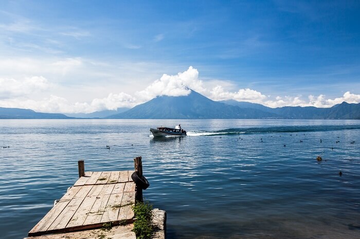 Beautiful view of Lake Atitlan in Panajachel with a boat entering the dock