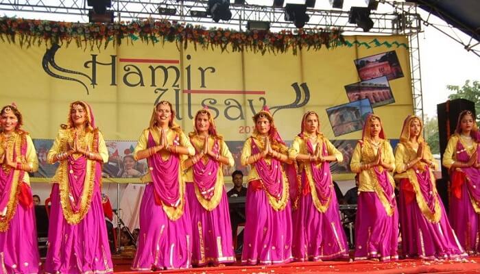 Dancers performing a cultural dance during the Hamir Utsav