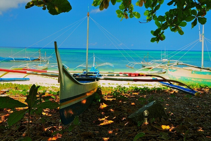 Boats docked at the Pamalican Island