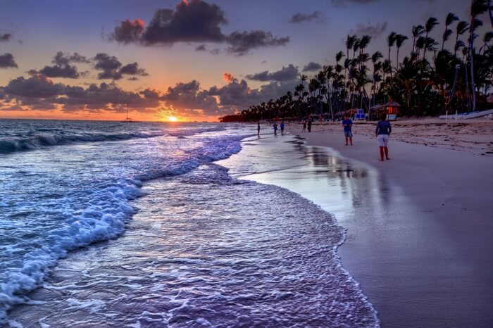 Waves along with the sun cast an orange hue on Radhanagar beach in Havelock island