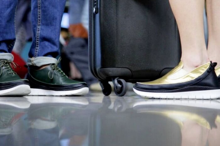 Travelers wearing the modular tech travel shoes