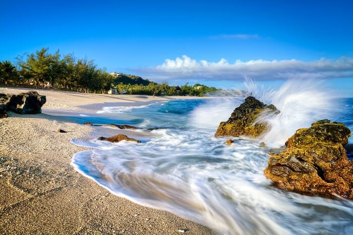 Waves lapping on the sandy beach at Boucan Canot on Reunion Island in the Indian Ocean