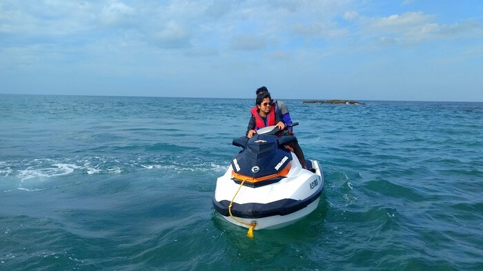 Asit and his wife on a jet ski in Andaman