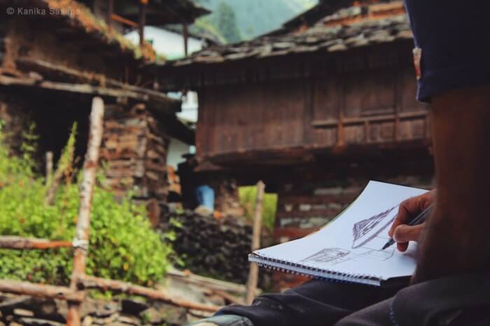 a close up of rahul sketching
