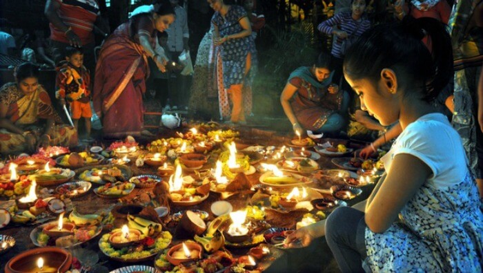A girl lights diyas on ‘Karthigai’
