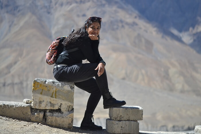 Avni sits on a stone in Kaza