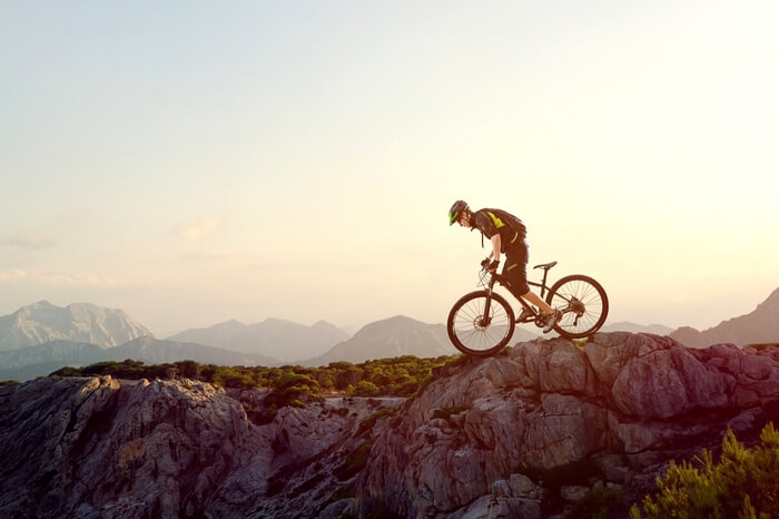 A mountain biker riding at the dawn