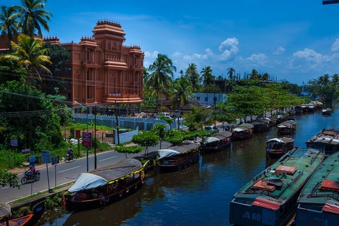 A distant shot of the Haveli Backwater Resort and the houseboats in the backwaters of Alleppey
