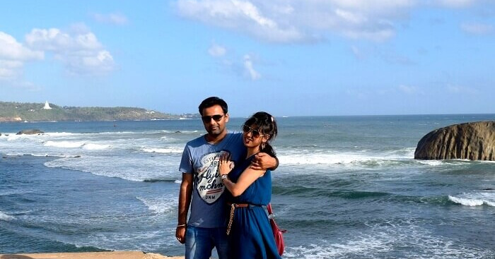 Priyanshu with his wife on a sea beach in Sri Lanka