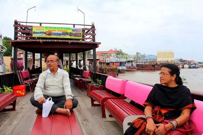 Avijits parents doing boating in the river in Cambodia