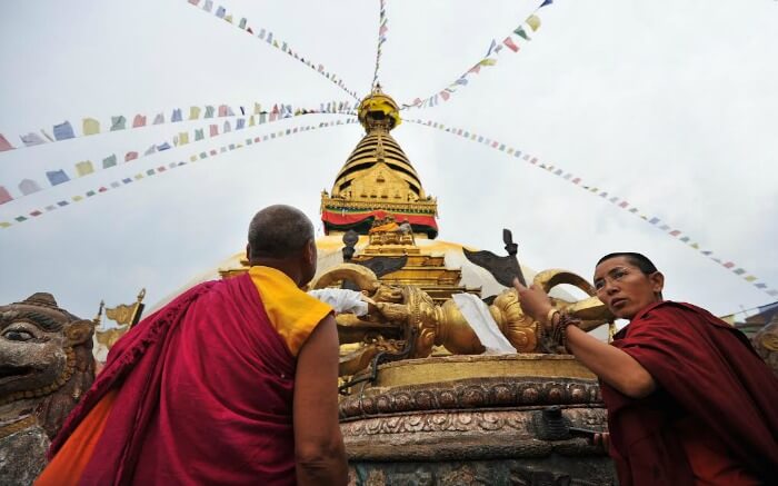Buddhist monks make offerings during Losar Festival in Nepal