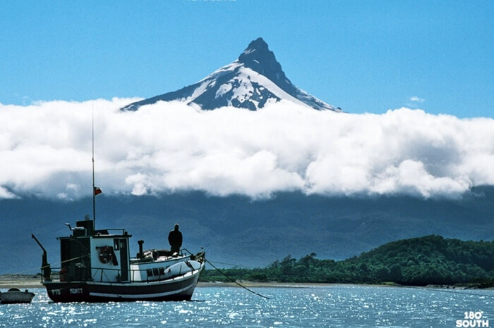 Traveler riding a boat in the documentary 180 Degree South