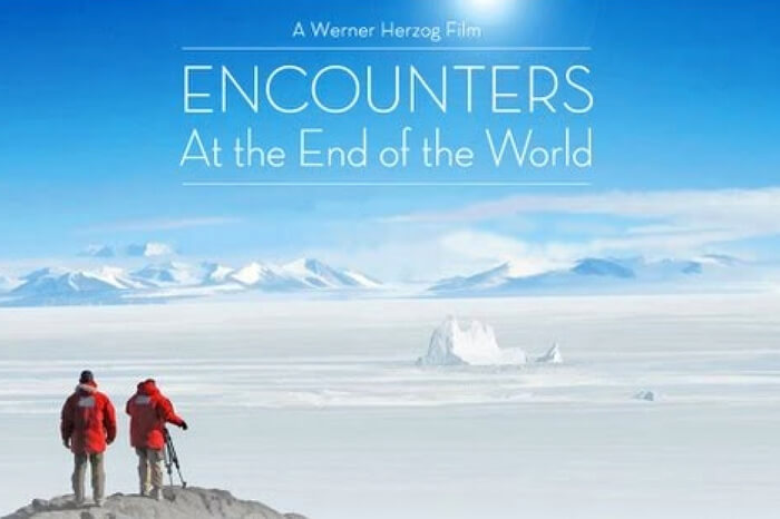 Travelers taking photographs at McMurdo Station in Antarctica in a scene from the documentary Encounters at the End of the World