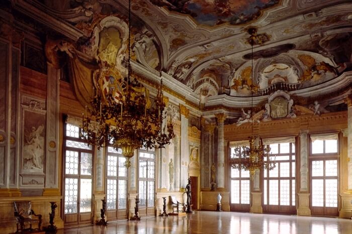 A view of Ca’ Rezzonico museum by the banks of Grand Canal in Venice