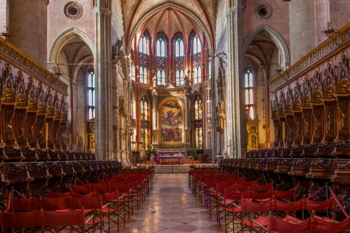 Visitors enjoying the sight of Santa Maria Gloriosa dei Frari in Venice
