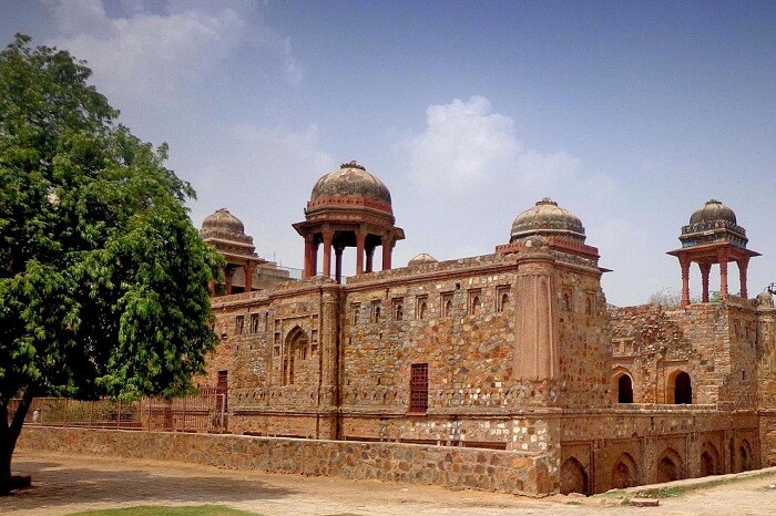 Tourists taking a walk through the lawns at the Jahaaz Mahal in Mehrauli
