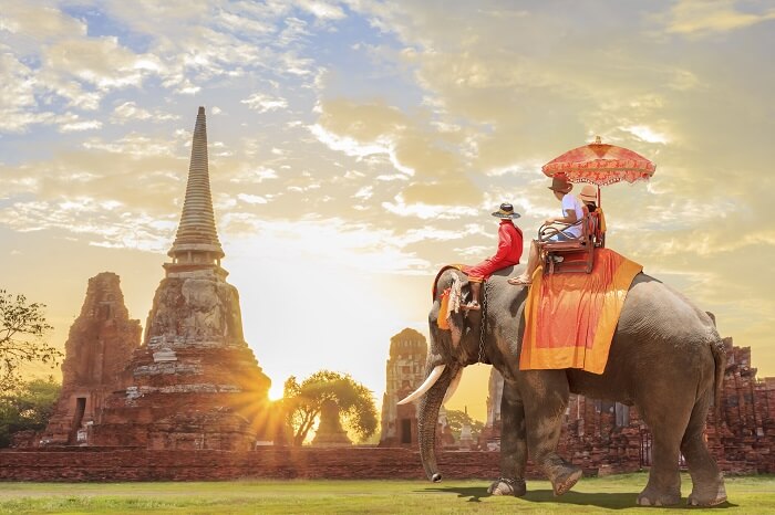 Tourists take an elephant ride in Thailand