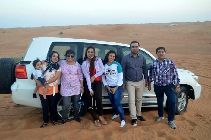 family enjoying desert safari together in Dubai