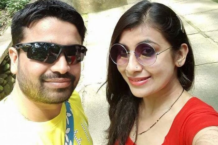 A couple clicking pics on their trip