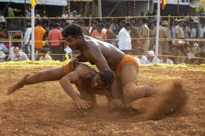 Wrestling match in progress at Hampi Utsav