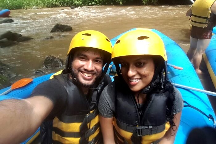 Couple enjoying river rafting