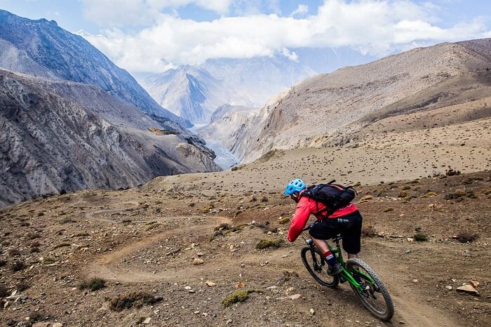 A tourist goes for mountain biking in Nepal
