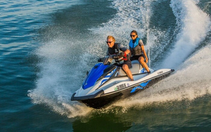 Honeymoon couple jet skiing in Australia