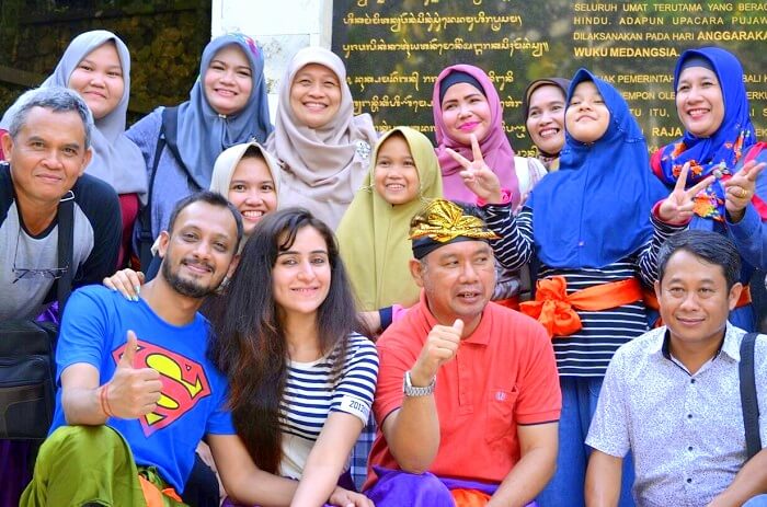 Sanchit and his wife have a group picture with the locals of Bali